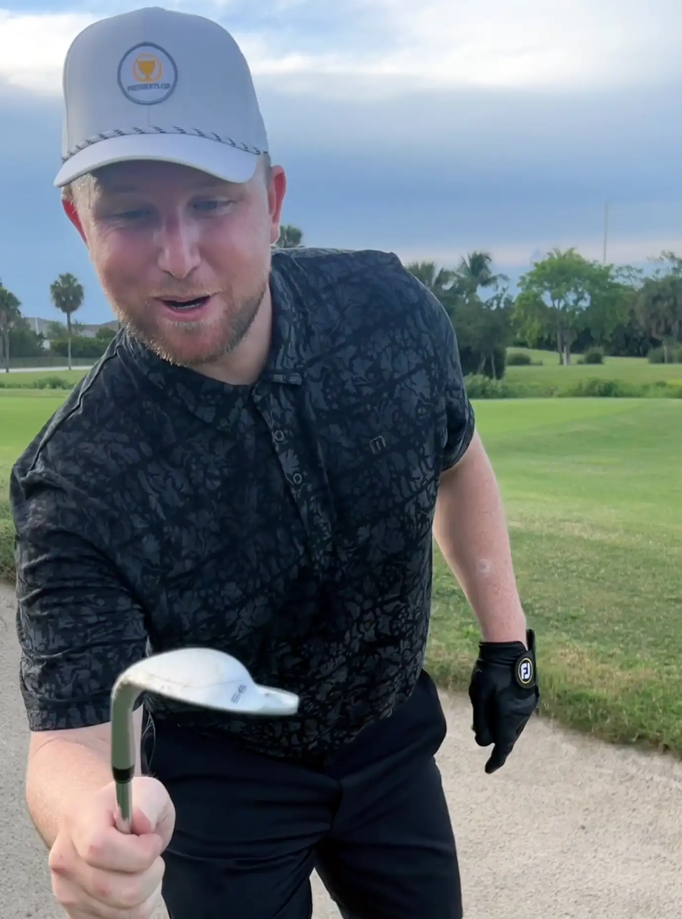 Image of a golfer holding the one wedge